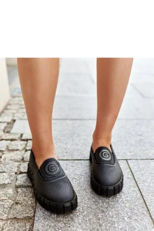 Black loafers on a massive sole